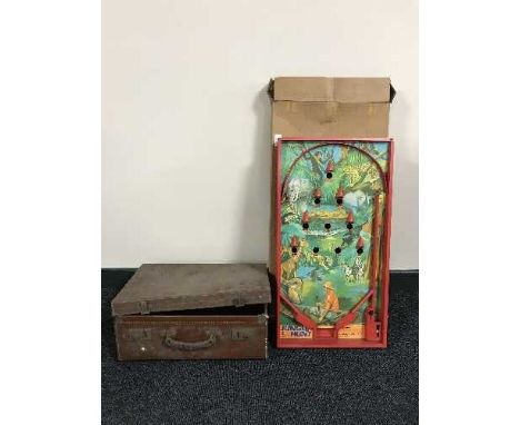 A bagatelle game in box and a vintage leather suitcase