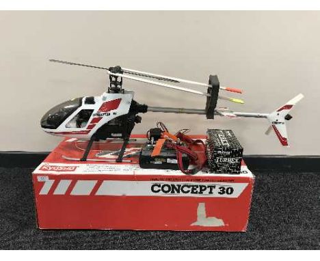 A Concept 30 petrol r.c. helicopter, control unit, boxed model engine starter and bag of accessories 