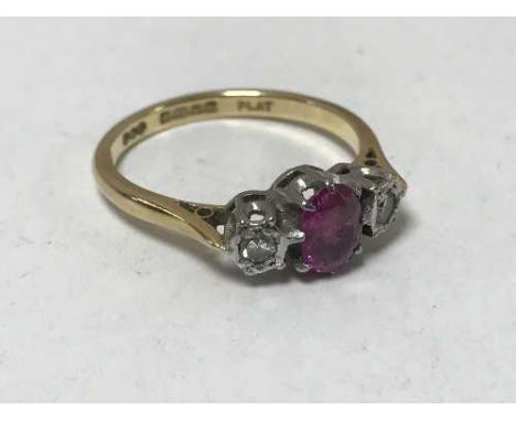 An 18ct gold and platinum set two stone diamond and ruby ring