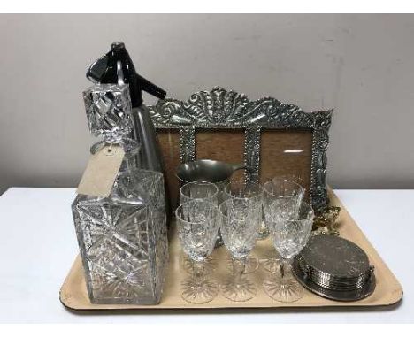 A tray of crystal decanter, six glasses, plated cake servers, soda syphon, pewter tankard, ornate photograph frame etc 