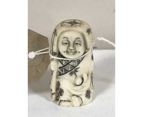 A carved bone Japanese netsuke 