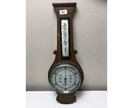 An inlaid mahogany barometer with silvered dial