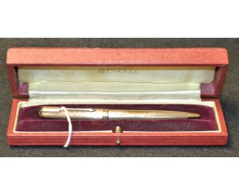 A Parker 61 Presidential 9 carat gold ballpoint pen, with engine turned Waterdrop pattern decoration throughout, vacant reser