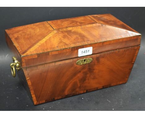 A Regency rosewood crossbanded mahogany sarcophagus tea caddy, hinged cover enclosing a bowl flanked by a pair of lidded comp