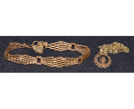 A 9ct gold gate bracelet, padlock clasp;  a 9ct gold St Christopher, 15.8g (2)
