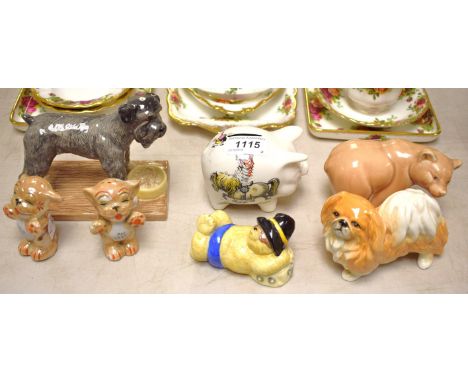 An Old Foley novelty Norman Thelwell piggy bank, printed with typical pony club images; a Beswick dog, 3165; a Royal Doulton 