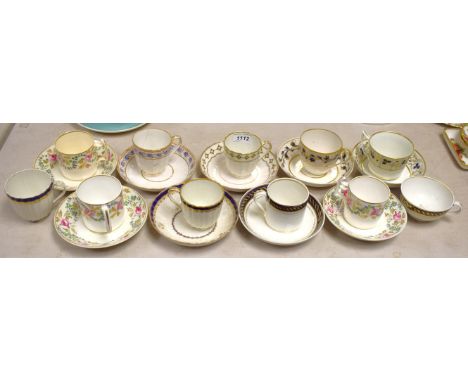 A Derby fluted coffee cup and saucer,  painted with a border of 'pearls', crown, crossed batons and D mark in puce, pattern 1