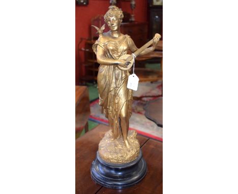 Continental School (early 20th century), a gilt and bronzed study, of a languid musician, she stands in flowing dress playing