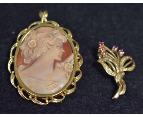 A 9ct gold floral spray brooch, five floral arms each terminating with a small pinky read ruby, stamped 375;  a 9ct gold moun