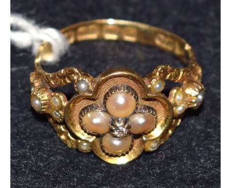 An early Victorian 18ct gold and seed pearl mourning ring, central diamond accent above a cluster of four pearls, shaped quat