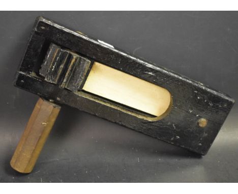 A WWI trench / ARP rattle, military arrow mark with the number 8 (painted in black and white)