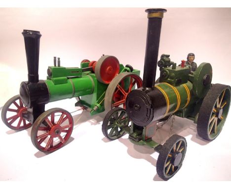 Large heavy metal model of traction engine and similar wooden example, approximate L: 35 cm, H: 30 cm. P&amp;P Group 3 (£25+V