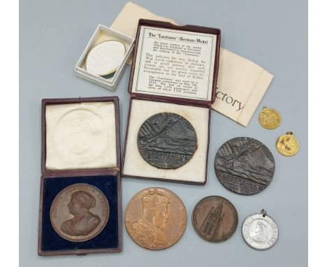 A 1902 Edward VII bronze coronation medal together with a commemorative bronze medal for George Handel,two Lusitania medal an