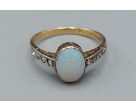 A yellow gold opal and diamond ring set with cabochon opal flanked by diamond shoulders, ring size L, 1.9gms 