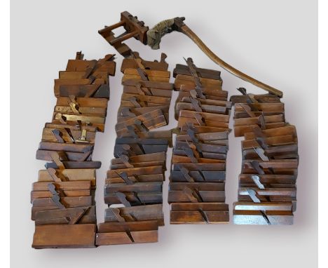 A large collection of moulding planes and an Adze tool 
