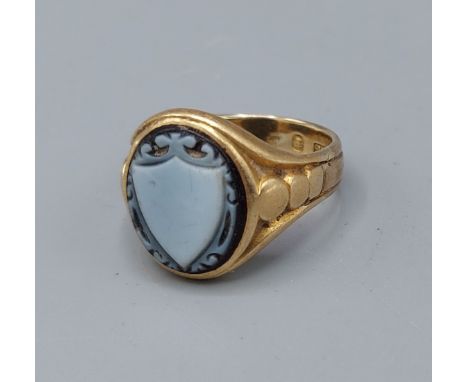 A 19th Century gold ring, set with a cameo shield 