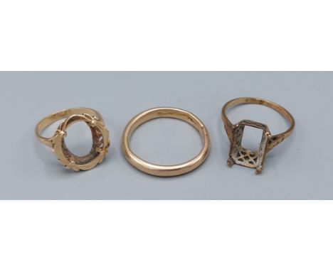 A 9ct yellow gold ring missing stone, together with another similar unmarked ring and an unmarked yellow gold wedding band, 9