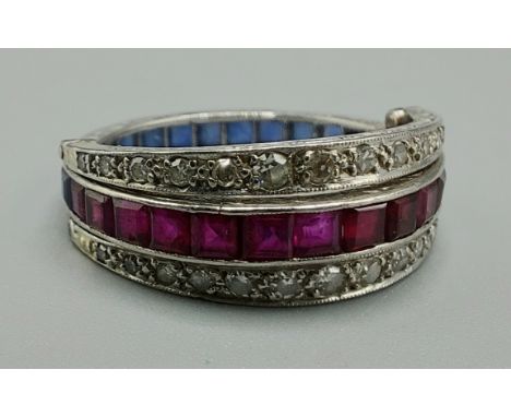 A white metal day and night hinged full eternity ring, set with diamonds, rubies and sapphires, 3.9gms, ring size K 
