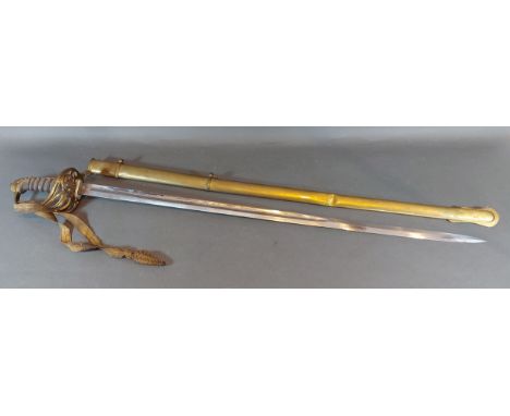 A Victorian officers sword with brass hilt and scabbard, blade length 81cms long 