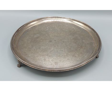 A Victorian silver salver of circular form, London 1886, maker William Hutton and Sons, 19ozs, 26cms diameter 