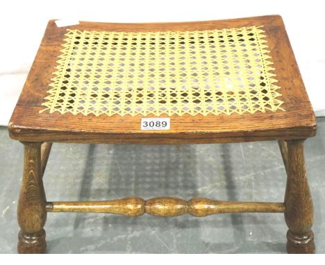 A 19th century elm framed stool with turned supports and stretchers, and a later cane work top. Not available for in-house P&