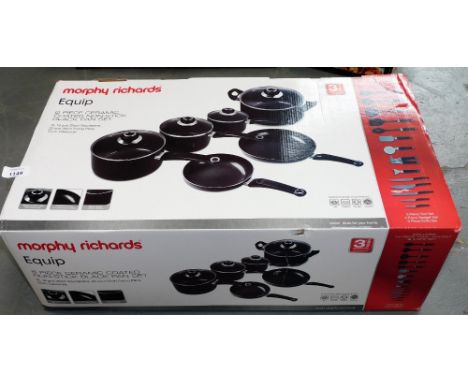 A Morphy Richards Equip six piece ceramic coated non stick black pan set, with various tools and utensils. Note: VAT is payab