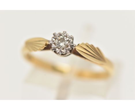 A YELLOW METAL SINGLE STONE RING, a transitional cut diamond, prong set in an a white metal illusion setting, leading on to a