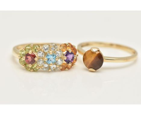 TWO 9CT GOLD GEM SET RINGS, the first a single faceted tigers eye prong set in yellow gold, the second a multi gem stone clus
