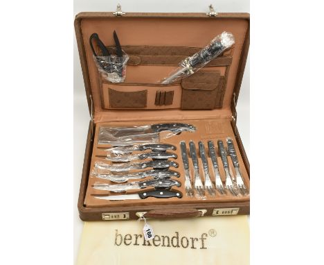 A 'BERKENDORF' BRIEFCASE CANTEEN, complete with steak knives and forks, butcher knife, other kitchen knives, sharpening steel