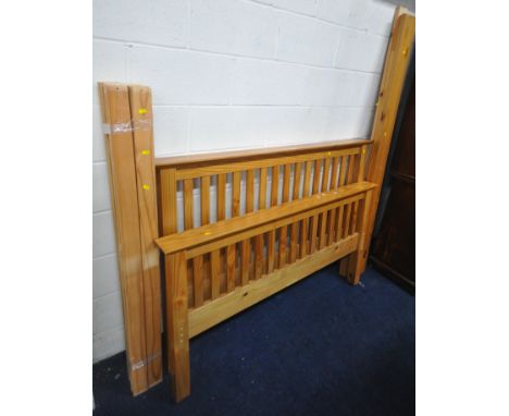 A MODERN PINE 4FT6 BEDSTEAD, with side, slats and bolts (condition report: scuffs and scratches)