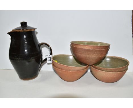 A GROUP OF LEACH POTTERY ITEMS, comprising a coffee pot/covered jug, in a tenmoku glaze, height 24cm, and six bowls with a pa