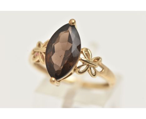 A 9CT GOLD GEM SET RING, a marquise cut smoky quartz, prong set in yellow gold, hallmarked 9ct Birmingham, ring size R, appro