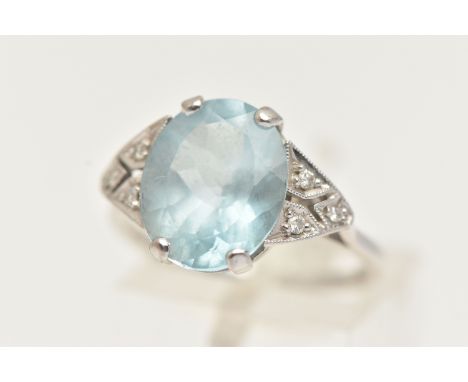AN 18CT GOLD AQUAMARINE AND DIAMOND RING, an oval cut aquamarine, approximate carat weight 3.80ct, flanked with six round bri