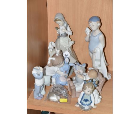 A LLADRO FIGURE AND A GROUP OF NAO FIGURES, comprising Lladro Girl with Doves/ Pigeons, no 4915, sculptor Salvador Debon, iss