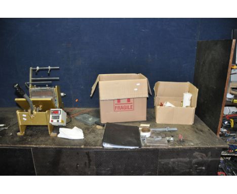 A CAST IRON HOT FOIL PRINTER with boxes containing foils, cards, coasters, letters and tools (PAT pass and working)