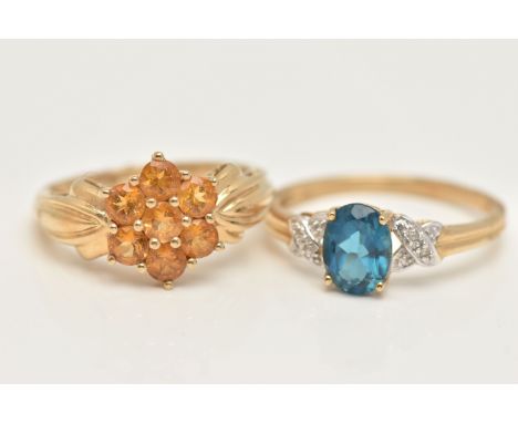 TWO 9CT GOLD GEM SET RINGS, a blue topaz yellow gold ring and a citrine cluster ring in yellow gold, hallmarked 9ct Birmingha