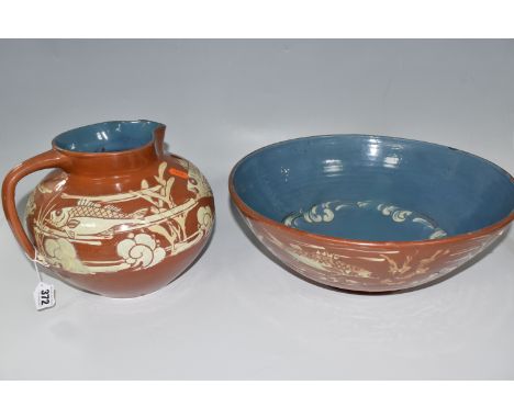 A C.H BRANNAM BARUMWARE JUG AND BOWL comprising a brown sgraffito Barum bowl with glazed blue interior and a river scene patt