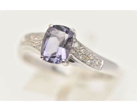 A 9CT GOLD GEM SET RING, a fancy cut amethyst flanked with cubic zirconia set shoulders, hallmarked 9ct Birmingham, ring size