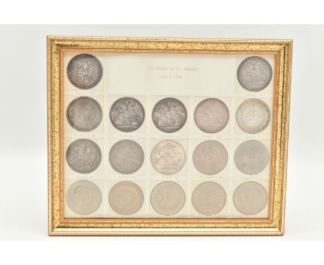 A GLAZED DISPLAY OF CROWN COINS AND COMMEMORATIVES, to include George III Crown 1819 slight ding 10 O'clock, George IIII Crow