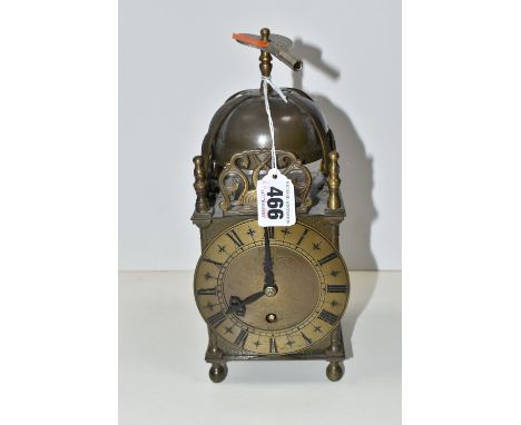 A SMITHS EIGHT DAY LANTERN CLOCK, with brass case decorated with pierced and engraved dolphin/fish motifs, dial marked with R