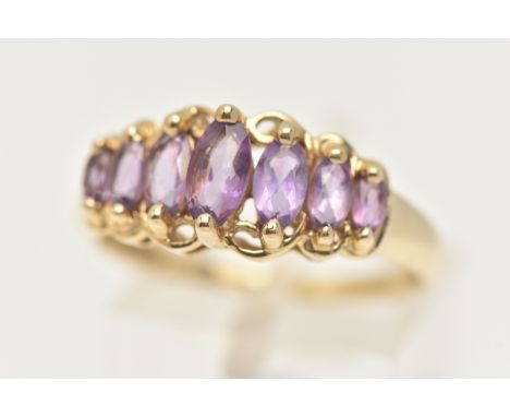 A 9CT GOLD GEM SET RING, seven marquise cut amethysts, prong set in yellow gold, hallmarked 9ct Birmingham, ring size R, appr