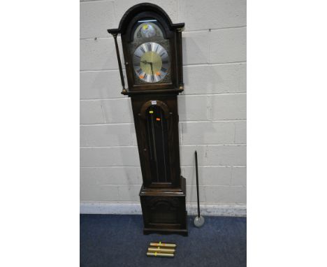 TEMPUS FUGIT, A 20TH CENTURY OAK LONGCASE CLOCK, the arched good with a glass door, that's enclosing a 9.5 inch brass and sil
