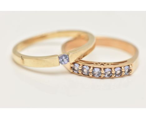 TWO 9CT GOLD GEM SET RINGS, a single stone ring and a six stone band ring, set with circular cut tanzanite, hallmarked 9ct Bi