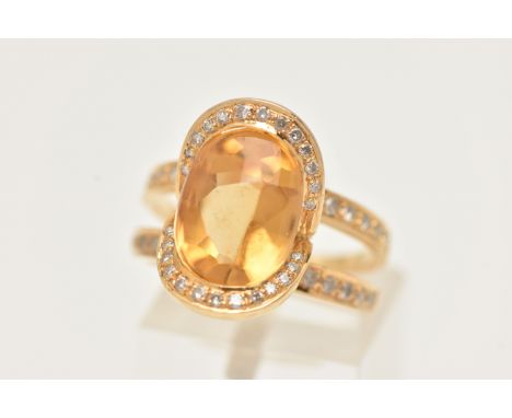 A MODERN YELLOW METAL CITRINE AND DIAMOND DRESS RING, set with an oval shape fancy cut Citrine, measuring approximately 11.5m