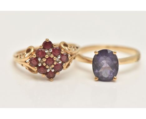 TWO 9CT GOLD GEM SET RINGS, the first a garnet cluster ring with diamond accents, scrolling detail to the shoulders, hallmark