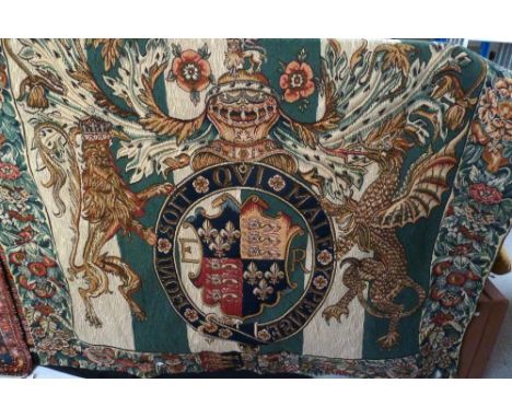 A modern French-style tapestry with crest flanked by lions with floral and fruit border, 140 x 126cm.