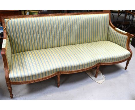 A 20th century gilt mahogany-framed three-seater sofa with serpentine front, scrolling arms and carved back rail, width 193cm