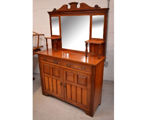 An early 20th century mahogany mirror-back sideboard, two short drawers over two cupboard doors opening to single shelf, leng