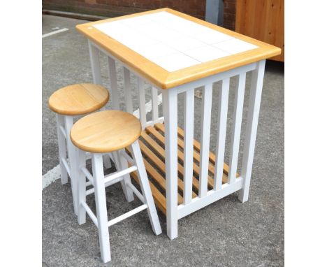 A beech tiled and painted kitchen block/breakfast bar with slatted under-shelf, length 90cm and two matching stools (3).