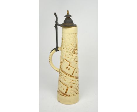 A Zsolnay glazed ceramic stein of large proportions, with a hinged pewter cover incorporated to the handle, the body relief-d